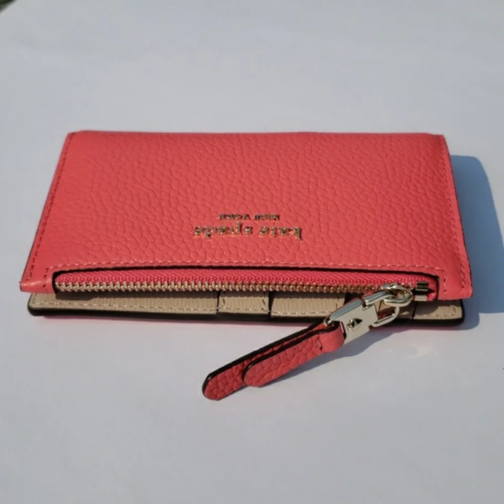 Kate Spade Leather Roulette Small Slim Bifold Wallet. Color: Peachmelba.